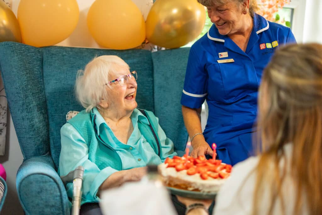 Residents and staff at Appleby Grange celebrating a birthday