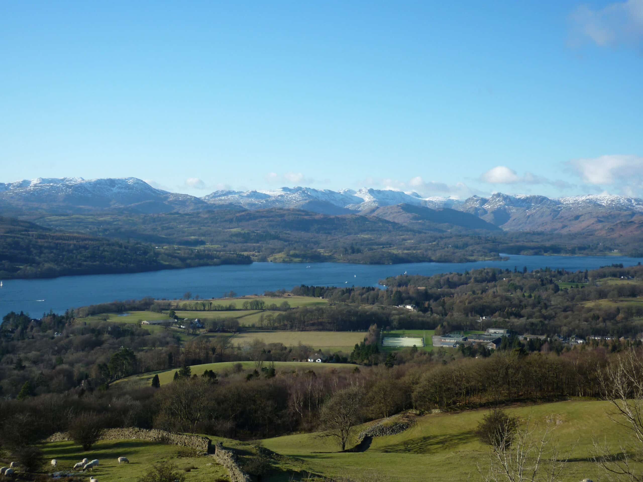 Scenic view of Lake Windermere, Cumbria, England with blue skies
